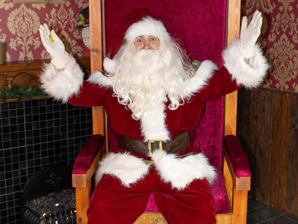 Father Christmas waiting to greet the kids